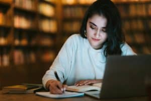 woman studying for north carolina real estate license exam