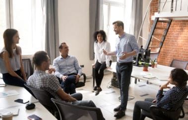 Group of North Carolina real estate brokers discussing comany culture in their brokerage