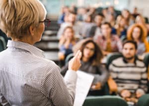 Mature instructor teaching a class at a North Carolina real estate school