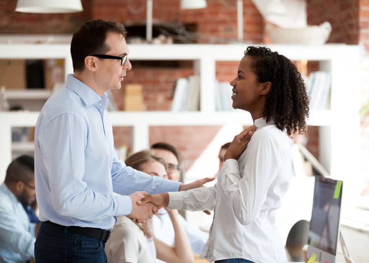 Young real estate broker interviewing with a broker-in-charge after recently passing her real estate exam