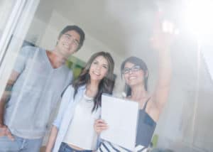 Young couple buying a house from a broker who's an expert in the local North Carolina real estate market