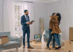 Real estate broker who's just helped a young couple find their dream home