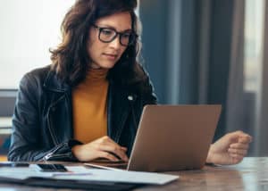 Woman deciding whether to become a North Carolina real estate broker