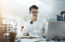 Shot of a young businessman working in an office