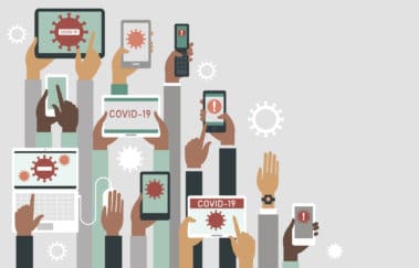 Human hands holding various smart devices with coronavirus alerts on their screens.