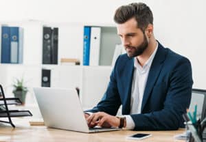 Man in a suit on computer