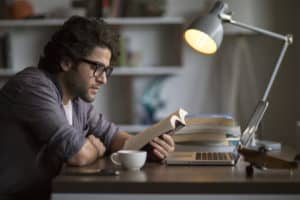 man reading real estate book