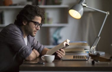 man reading real estate book