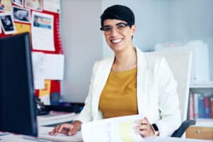 Portrait of a young businesswoman working at her desk