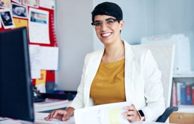 Portrait of a young businesswoman working at her desk
