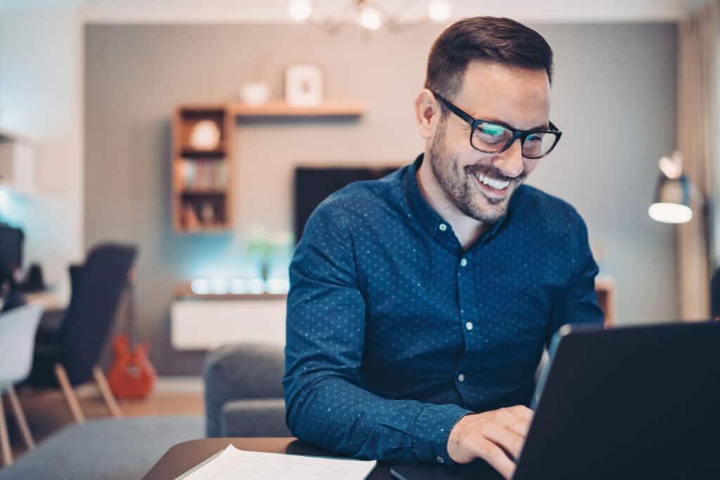 Businessman using laptop at home