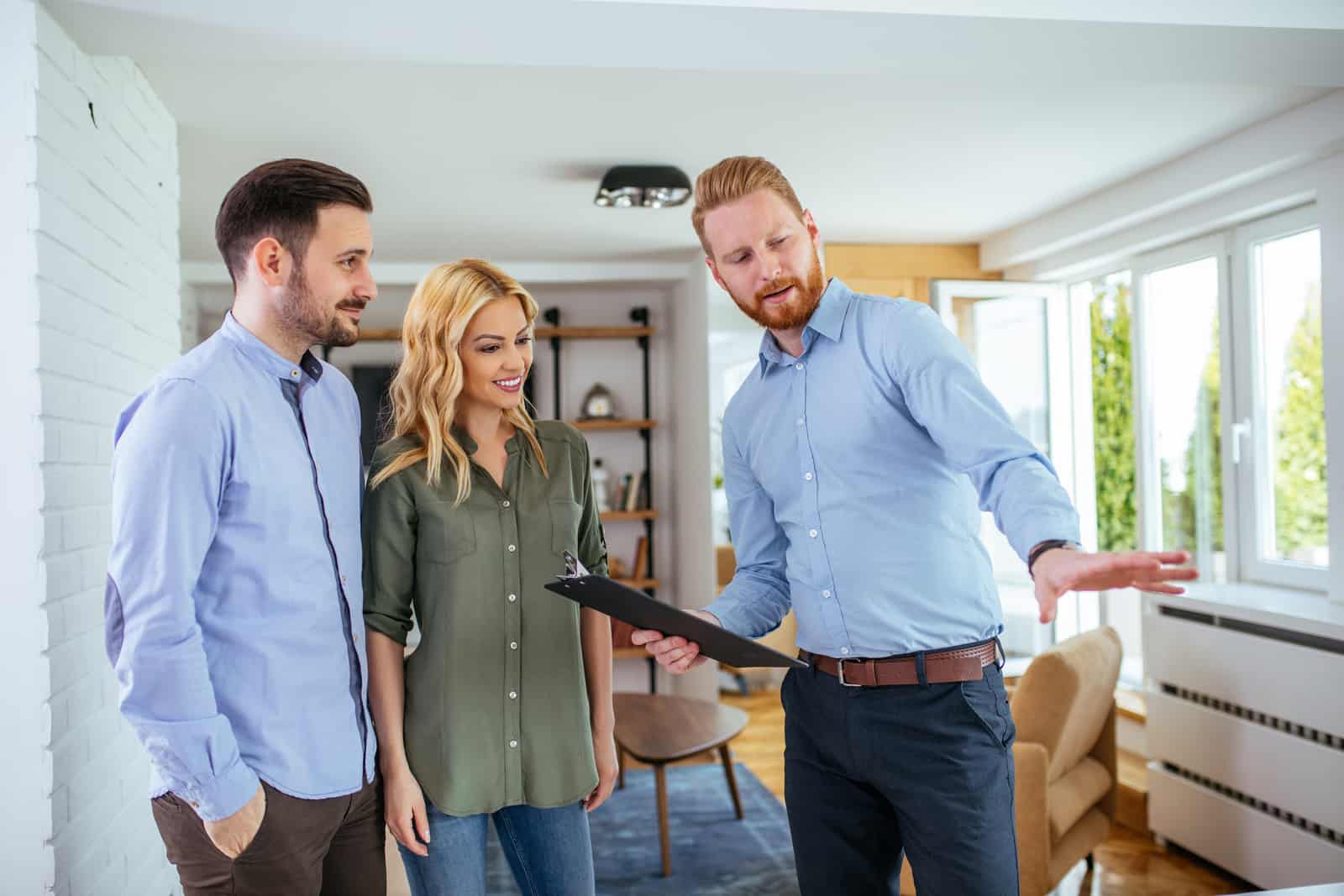 Young couple consulting with their real estate agent