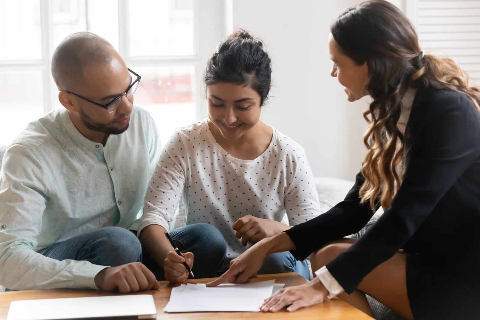 real estate broker talking to clients