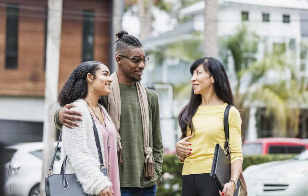 Realtor meeting with young African-American couple