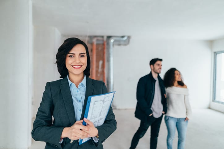 Real estate professional smiling to the camera