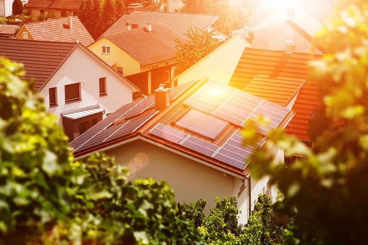 Solar panels on tiled roof of house in residential neighborhood