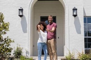 Excited couple show off new home