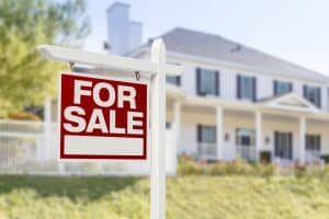 Home For Sale Sign in Front of New House