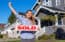 Young Hispanic Realtor with SOLD Sign