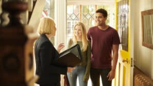 Local real estate market expert greets house hunting couple