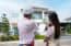 real estate broker and appraiser look at home