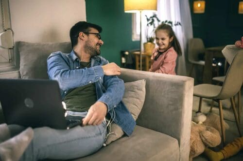 stay at home dad interacts with child