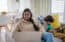 mother works while child is nearby – side jobs for stay-at-home moms